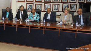 On the left are representatives from the SER, and on the right members of the Council of Ministers, in the Dr. A. C. Wathey Legislative Hall at the Government Administration Building. (DCOMM)