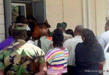 Five police officers charged with murder