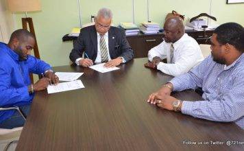 Prime Minister Gumbs signs for Middle Region sewage connections