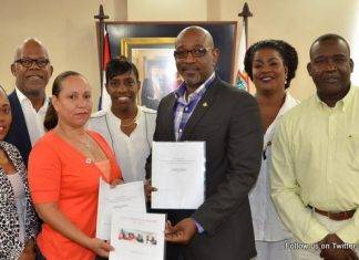 Minister TEATT Connor Signs-off on Chamber of Commerce & Industry Rules of Procedure.