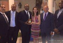 Minister TEATT Connor presents Kingdom Consul General in Miami with Token of Appreciation during Trade Mission