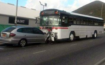 Head on collision between a family car and a School Bus