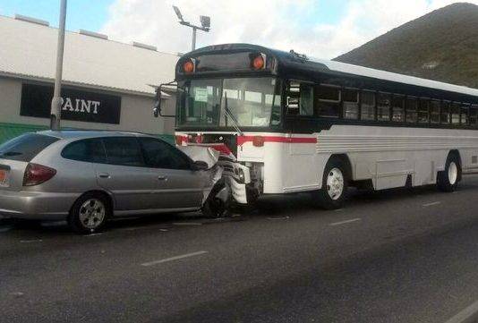 Head on collision between a family car and a School Bus