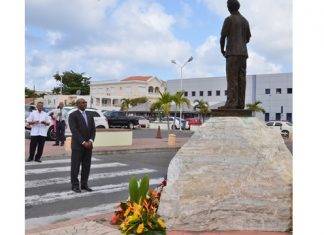 Minister Connor lays wreath on behalf of COM at 89th birthday commemoration of Dr. A.C. Wathey