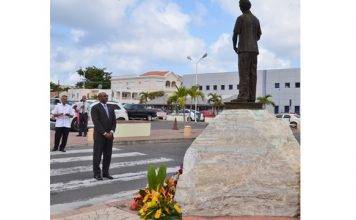 Minister Connor lays wreath on behalf of COM at 89th birthday commemoration of Dr. A.C. Wathey
