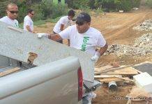 Nagico Volunteers Assist with Clean-up of Mangroves, Illegally Dumped Material at Belair Pond