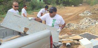 Nagico Volunteers Assist with Clean-up of Mangroves, Illegally Dumped Material at Belair Pond