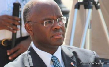 Governor Holiday receives progress report from W. Marlin