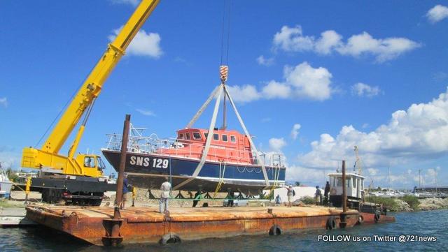 Sea Rescue Boat being loaded onto Barge-001