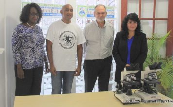 AUIS presented two microscopes to Charlotte Brookson Academy