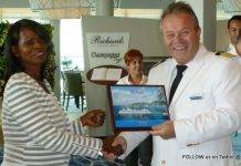 Minister of Tourism Arrindell, Port officials and Captain of Mein Schiff 3 Exchange Plaques on Inaugural Call