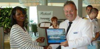 Minister of Tourism Arrindell, Port officials and Captain of Mein Schiff 3 Exchange Plaques on Inaugural Call