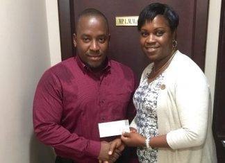 Ralph Contave author receives assistance from MP Marlin-Romeo for book on culture, politics and youth empowerment