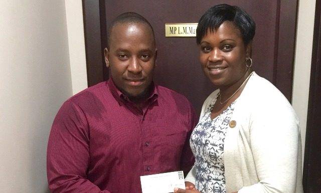 Ralph Contave author receives assistance from MP Marlin-Romeo for book on culture, politics and youth empowerment