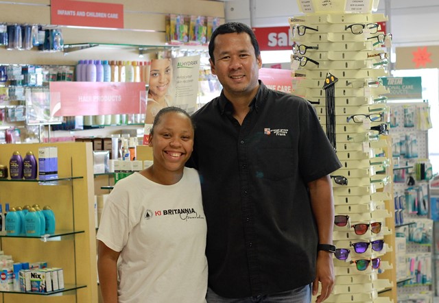 L-R, K1 Britannia Poject Manager Ms. Chiaira Bowers with Owner of Orange Grove Pharmacy Mr. Franklin Chang Sing Pang
