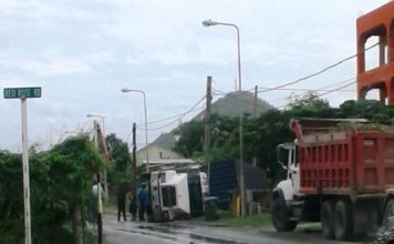 20 foot trailer toppled over on LB Scott road