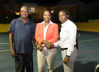 Minister Jacobs repairs lights at local basketball courts
