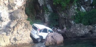 Body discovered protruding out of vehicle window
