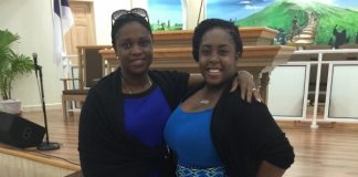 Ariella Bussue receives assistance from MP Marlin-Romeo Give Back to the Community Program