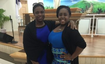 Ariella Bussue receives assistance from MP Marlin-Romeo Give Back to the Community Program
