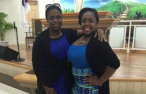 Ariella Bussue receives assistance from MP Marlin-Romeo Give Back to the Community Program