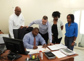 Minister Emmanuel finalizes agreement with Mildrum Road reps