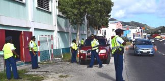 Police cadets hold traffic controls