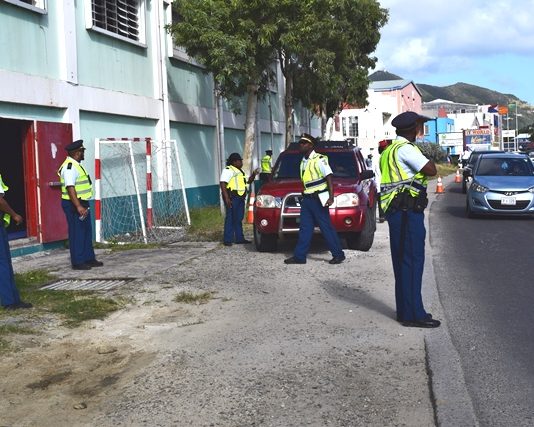 Police cadets hold traffic controls