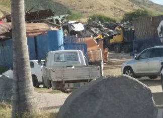 BREAKING NEWS: Local authorities raid Pond Island metal scrap company