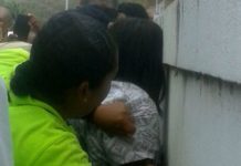 Police restrains mental patient.