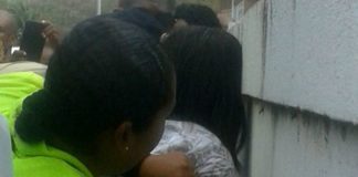 Police restrains mental patient.