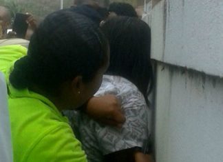 Police restrains mental patient.