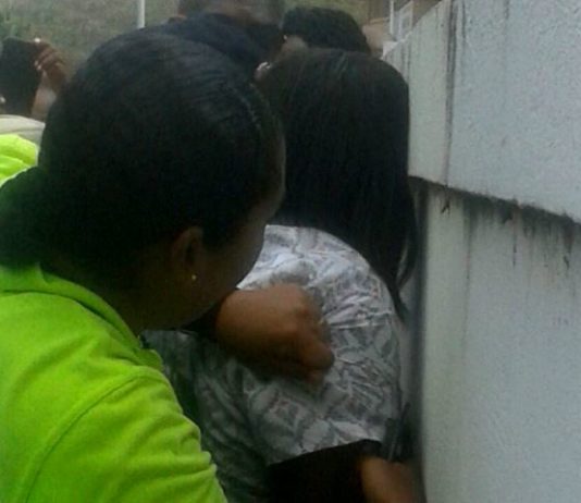 Police restrains mental patient.