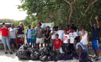 MPC students clean-up Mullet Bay Beach
