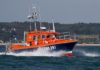 Volunteer crew members of SNSM rescue couple