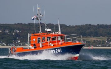 Volunteer crew members of SNSM rescue couple