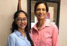 President of Parliament Sarah Wescot presented with reusable canvas bags proposal by Creative Hands.