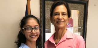 President of Parliament Sarah Wescot presented with reusable canvas bags proposal by Creative Hands.