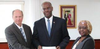 Governor Holiday receives report informateurs