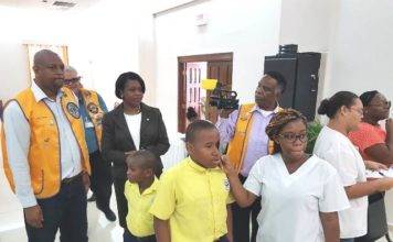 Prime Minister Romeo Marlin visits the Lions Club Eye Screening Project