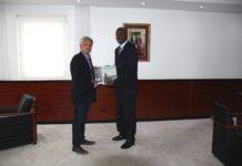 Governor receives final report Theodore Heyliger