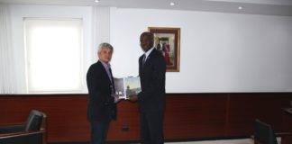 Governor receives final report Theodore Heyliger