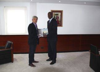 Governor receives final report Theodore Heyliger