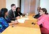Minister Plenipotentiary and deputy Minister Plenipotentiary sign declaration with Electoral Council