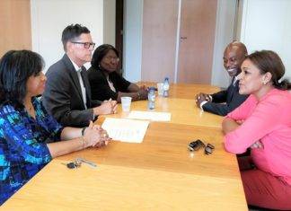 Minister Plenipotentiary and deputy Minister Plenipotentiary sign declaration with Electoral Council