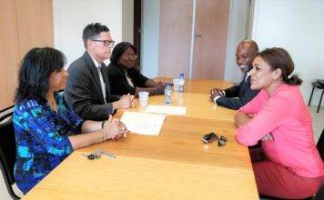 Minister Plenipotentiary and deputy Minister Plenipotentiary sign declaration with Electoral Council