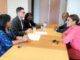Minister Plenipotentiary and deputy Minister Plenipotentiary sign declaration with Electoral Council