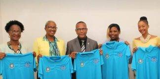 Handing Over the EOM Polo Shirts to the Minister of Education