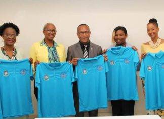 Handing Over the EOM Polo Shirts to the Minister of Education