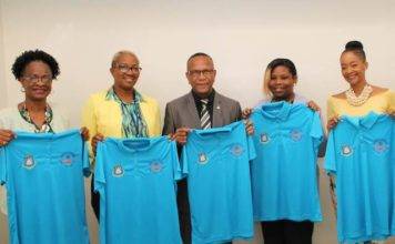 Handing Over the EOM Polo Shirts to the Minister of Education